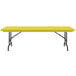 A yellow rectangular Correll folding table with black legs.