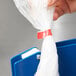 a hand holding a plastic bag