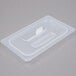 A translucent plastic lid with a handle for a food container.