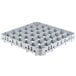 A white plastic Cambro rack with holes for 36 stemware glasses.
