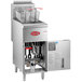 An Avantco stainless steel floor fryer with an open door and a basket inside.