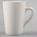 A Tuxton white china mug with a handle.