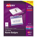 A purple package of white Avery name badge clip holders with a yellow and red label.