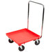 A red Vollrath Traex dolly with black wheels.