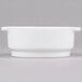 An Arcoroc white porcelain soup bowl with a handle on a white background.