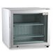 A white countertop display freezer with a glass door.