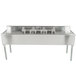 An Eagle Group stainless steel underbar sink with three bowls, two drainboards, and a splash mount faucet.