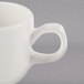 A Libbey ivory porcelain medium mug with a handle.