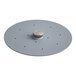 A grey circular metal plate with holes and a silver knob.