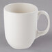 A Libbey ivory porcelain mug with a handle.