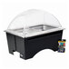 A black Sterno chalkboard chafing dish with clear dome lid on a counter.