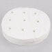 A stack of white circular Patty Paper with holes in it.