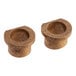 Two bronze Vulcan bushings on a counter.