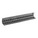 A black metal radiant with holes for screws.