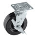 A Vulcan black and silver metal caster wheel with brake.