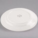 A Libbey ivory porcelain plate with a circular design on it.