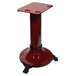 A red pedestal stand with black legs for an Omas meat slicer.