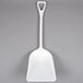 A white plastic Carlisle Sparta food service shovel.