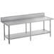 A long stainless steel Advance Tabco work table with undershelf.