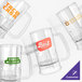 A close-up of a customizable clear plastic beer mug with a handle.