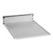 A stainless steel metal crumb tray with screws on a metal shelf.