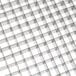 A metal grid with square openings.