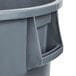 A gray Continental Huskee round trash can with a handle.