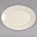 A white oval china platter with a rolled edge.