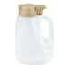 A translucent 64 oz. dispenser jar with a beige top and handle.