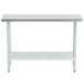 An Advance Tabco stainless steel work table with a shelf.