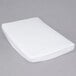 A white L.A. Baby fitted crib sheet on a gray surface.