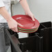 a person holding a stack of plates