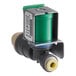 A close up of a Scotsman water inlet valve with a green plastic cover.