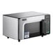 A stainless steel Amana commercial microwave with a glass door.