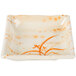 A white square bowl with orange floral designs on the inside.