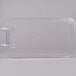 A clear plastic lid with a white border and a metal handle.
