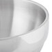 A close-up of a Vollrath stainless steel serving bowl.