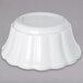 A white Carlisle scalloped ramekin.