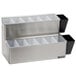 A silver San Jamar stainless steel condiment bar with 12 plastic compartments on a counter.