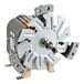 A small metal Moffat motor with a circular metal object.
