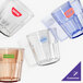 A group of Cambro Newport plastic tumblers in different colors.