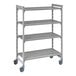 A grey metal shelving unit on wheels with 4 shelves.