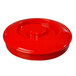 a red plastic lid with a nut