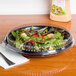 a plastic container of a salad dressing