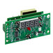 A green circuit board with a digital clock display.