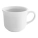 A close-up of a Tuxton white china cup with a handle.