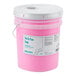 A pink Advantage Chemicals bucket with a white lid.