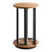 A round wooden table with a metal pole attached to it.