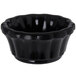 a black bowl with wavy edges