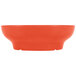 A red melamine salsa dish with a white interior.